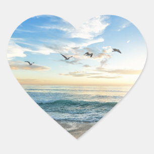 Birds in flight over the ocean heart sticker