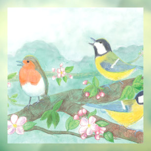Birds sing on a blossoming tree branch in spring