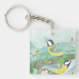 Birds singing on a blossoming tree branch key ring