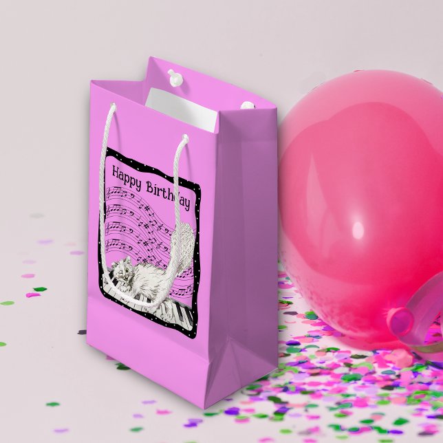 Birthday Cat on Piano Sheet Music Bright Pink Small Gift Bag (White happy cat on piano keys bars of music notes in black frame on bright pink birthday gift bag.)