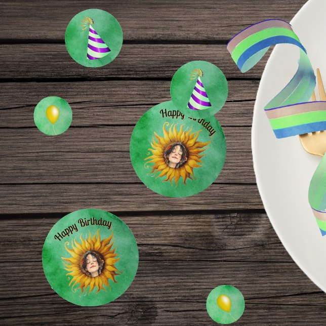 Birthday Girl Pretty Face in Sunflower Hats Green Confetti (Pretty girl in big yellow sunflower, party hats, yellow balloons on green table Birthday confetti.)