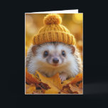 Birthday Hedgehog In Autumn Leaves Card<br><div class="desc">A delightful hedgehog wears a warm,  knitted hat while nestled among vibrant autumn leaves.
All text can be changed.</div>