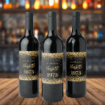 Birthday party black gold year born wine label<br><div class="desc">A black background decorated with golden confetti. The text: The name is written in dark rose gold with a large modern hand lettered style script. Personalise and add a date,  name and year of birth.</div>