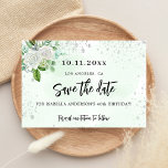 Birthday party floral white green elegant save the date<br><div class="desc">A girly and trendy Save the Date card for a 40th (or any age) birthday party. A stylish white and green watercolored background decorated with faux silver glitter sparkles, white florals and greenery. Personalise and add a date and name/age 40. Black coloured letters. The text: Save the Date is written...</div>