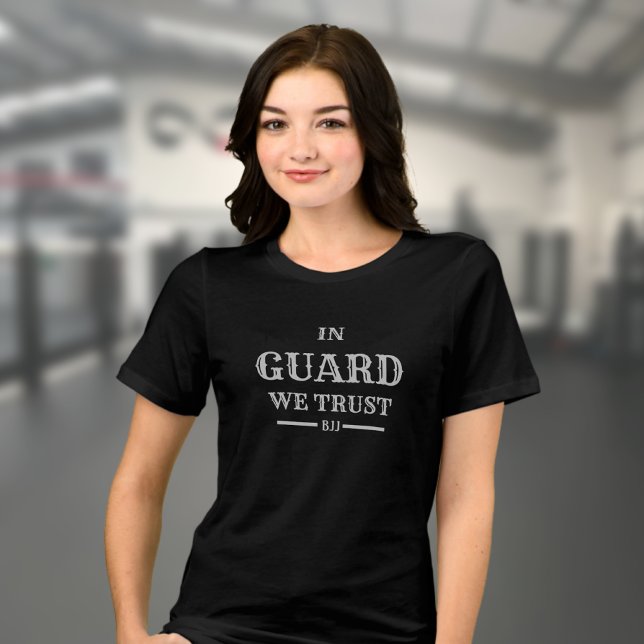 BJJ In Guard We Trust Brazilian Jiu Jitsu Woman's Tri-Blend Shirt (Woman's Brazilian Jiu Jitsu T-shirt in black on a female model in a gym. )
