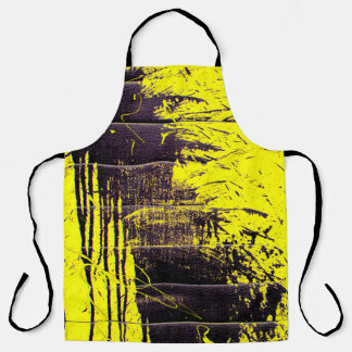 Black abstract splatter paint drips on a bright ye apron