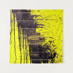 Black abstract splatter paint drips on a bright ye tapestry