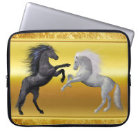 Black and a white Horse that are fighting