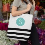 Black and Aqua Monogram Stripe Tote Bag<br><div class="desc">Personalise this chic black and white striped tote bag with your single initial monogram on a summery turquoise aqua circle badge for a tote that's uniquely yours! Design features a band of wide horizontal black stripes across the bottom, topped by your monogram in white on aqua. Makes a great gift...</div>