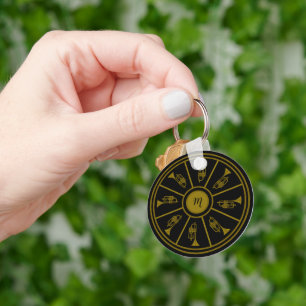 Black and gold motif with trumpets and a monogram key ring