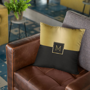 Black and gold split-screen geometric design cushion