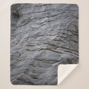 Black and gray striped textile sherpa blanket