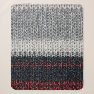 Black and grey knitting wool with red and white st sherpa blanket