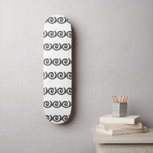 Black and grey spirals pattern on white skateboard