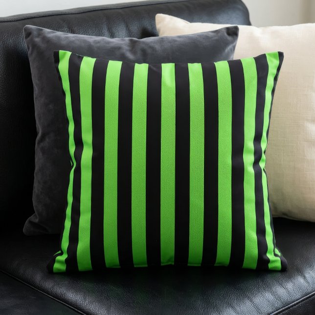 Black and Lime Green Stripes Pattern Cushion (A lime green and black stripes pillow sits on a black couch in front of other pillows.)