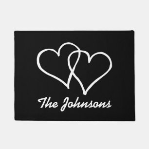 Black and white door mat with interlocked hearts