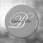 Black and White Fancy Script Monogram Grey Magnet<br><div class="desc">Wedding magnets with a minimalist couple's monogram in a fancy calligraphy script in black and white on a modern grey background. For shorter names, increase the font size of the bride and groom's names and their initial. Customise the modern calligraphy font styles and colours... as well as the background colour....</div>