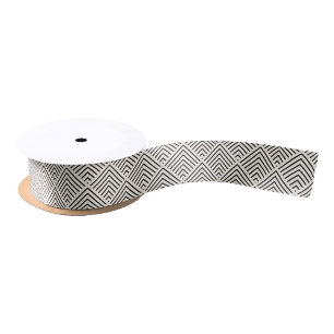 Black and white geometric pattern with overlapping satin ribbon