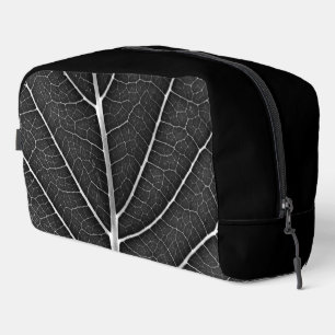 Black and white glowing leaf close-up dopp kit