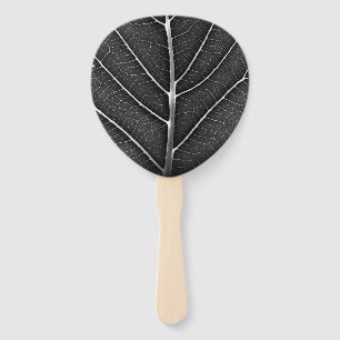 Black and white glowing leaf close-up hand fan