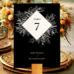Black and White Greenery Wedding Table Number<br><div class="desc">This Black and White Greenery Wedding Table Number design offers a classic combination of simple minimalist typography with a neutral black and white colour story and chic line art greenery. The moody leaf silhouette embellishments are artfully arranged to create a beautiful flowing shape that sets off the polished geometric elements,...</div>