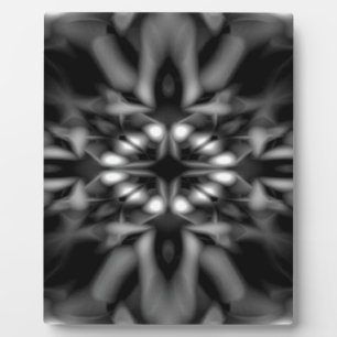 Black and white kaleidoscope pattern plaque