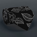 Black And White Leafy NeckTie<br><div class="desc">Elevate your evening attire with this striking black necktie,  featuring a crisp white floral and leaf motif. The high-contrast botanical print offers a fresh,  modern take on traditional floral patterns,  making it a versatile piece for weddings,  galas,  or high-stakes boardroom meetings.</div>