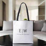 Black and White Minimalist Modern Monogram Tote Bag<br><div class="desc">Introducing our Black and White Minimalist Modern Monogram Collection: Embrace simplicity and sophistication with our minimalist designs, curated to elevate your style effortlessly. Crafted with a keen eye for modern aesthetics, this collection features sleek black and white designs accentuated by personalised monograms. From chic stationery to versatile accessories, our collection...</div>