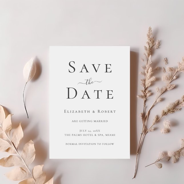 Black and White Minimalist Save the Date Card (Black and White Minimalist Save the Date Card on a table with blush dry flowers.)