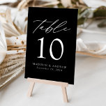 Black and White Modern Elegance Wedding Table Number<br><div class="desc">Trendy, minimalist wedding table number cards featuring white modern lettering with "Table" in a modern calligraphy script. The design features a black background or colour of your choice. The design repeats on the back. To order the table cards: add your name, wedding date, and table number. Add each number to...</div>