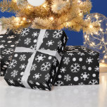 Black and White Modern Snowflakes Christmas Wrapping Paper<br><div class="desc">Introducing our Vintage Noir Snowflake Christmas Wrapping Paper, a perfect blend of timeless elegance and contemporary charm. This wrapping paper boasts a Super cute black Christmas background that exudes sophistication and style. Against this rich black canvas, modern white snowflakes dance and twirl, creating a striking contrast that captures the essence...</div>