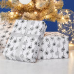 Black and White Modern Snowflakes Christmas Wrapping Paper<br><div class="desc">Introducing our Vintage Monochrome Christmas Wrapping Paper, a delightful blend of vintage aesthetics and contemporary design. This charming wrapping paper features a Super cute white Christmas background adorned with modern black and white Christmas ornaments, each delicately detailed with intricate snowflakes. The timeless combination of black and white creates a sophisticated...</div>