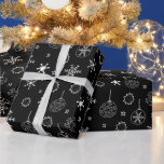 Black and White Modern Snowflakes Christmas Wrapping Paper<br><div class="desc">Introducing our Vintage Noir Christmas Wrapping Paper, a delightful blend of old-world charm and contemporary elegance. This unique wrapping paper features a Super cute black Christmas background adorned with modern black and white snowflakes and Christmas ornaments, creating a captivating and sophisticated design. The deep black backdrop sets the stage for...</div>