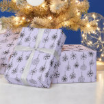 Black and White Modern Snowflakes Purple Christmas Wrapping Paper<br><div class="desc">Introducing our Vintage Elegance Christmas Wrapping Paper, featuring a Super cute light purple Christmas background adorned with modern black and white Christmas ornaments delicately embellished with intricate snowflakes. This enchanting wrapping paper effortlessly combines vintage charm with contemporary design, creating a delightful and festive ambiance for your holiday gifts. The soft...</div>