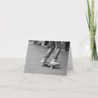 black and white photo in skate park, feet on board