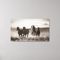 Black and White photo of a Cowboy Lassoing Horses