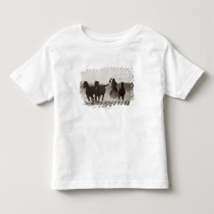 Black and White photo of a Cowboy Lassoing Horses Toddler T-Shirt