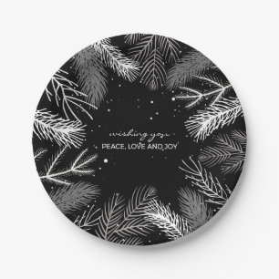 Black and white pine tree leaves with snow paper plate