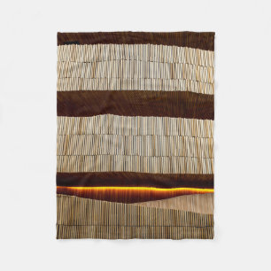 Black and white striped textile fleece blanket