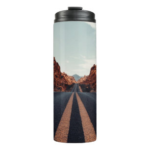 BLACK ASPHALT ROAD BETWEEN BROWN ROCK FORMATION UN THERMAL TUMBLER