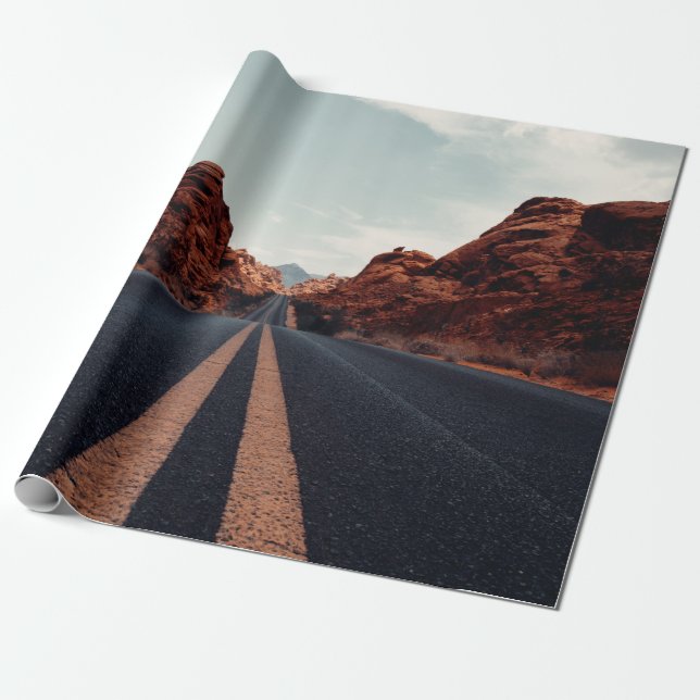 BLACK ASPHALT ROAD BETWEEN BROWN ROCK FORMATION UN WRAPPING PAPER (Unrolled)