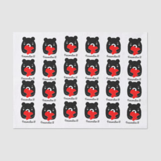 Black bear holding a heart tissue paper