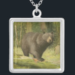 Black Bear Stepping on a Tree Trunk Silver Plated Necklace<br><div class="desc">This fine art print by Oliver Kemp illustrates a brown bear stepping on a fallen tree in a forest. The pastel green colours are calming for the eye and create a nice warm feeling of the awakening nature in the spring. A great addition to any rustic home decor!</div>