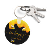 Black bee happy bumble bees sweet honey monogram key ring<br><div class="desc">A chic black background decorated with golden dripping honey. The text: Bee Happy with a golden hand lettered style script with swashes.  Personalise and add your name,  family name.</div>