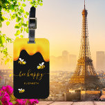 Black bee happy bumble bees sweet honey monogram luggage tag<br><div class="desc">A chic black background decorated with golden dripping honey. The text: Bee Happy with a golden hand lettered style script with swashes.  Personalise and add your name.</div>