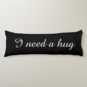 Black body pillow with custom text   I need a hug