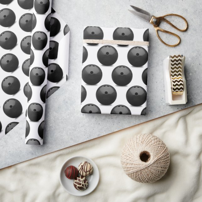 black bowling ball on white wrapping paper (Crafts)
