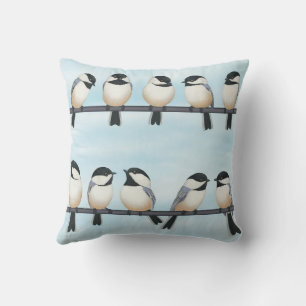 black capped chickadees on a line cushion