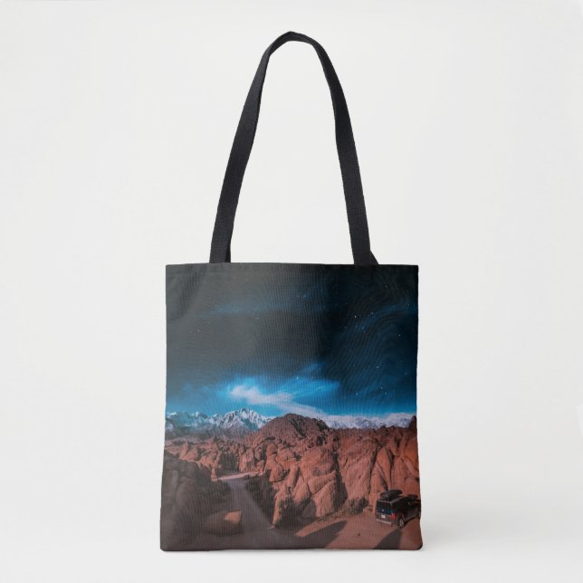 BLACK CAR NEAR ROCK FORMATIONS TOTE BAG (Front)