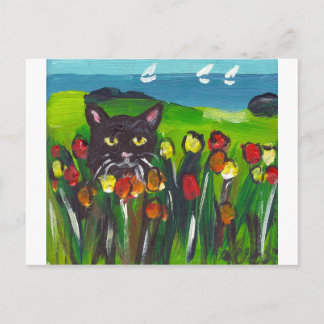 Black cat amongst tulips postcard